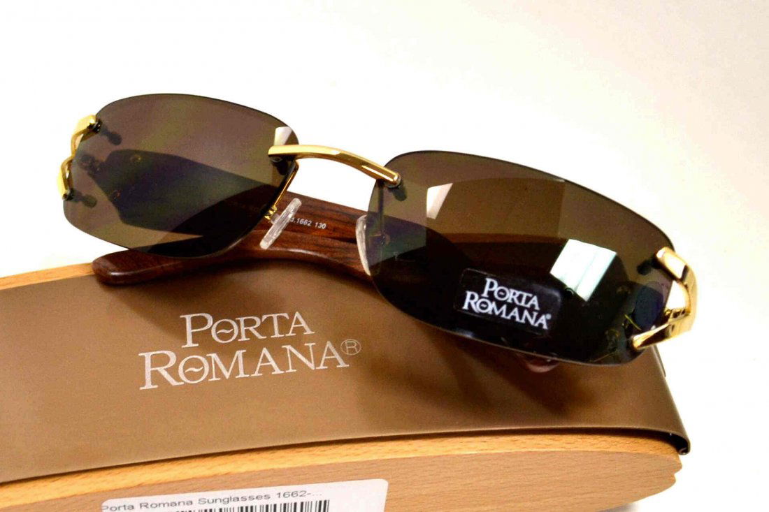 Porta Romana Sunglasses: Lady's Porta Romana sunglasses model #1662 with gold temple accents, boobinga wood sides, wooded box and never been worn.