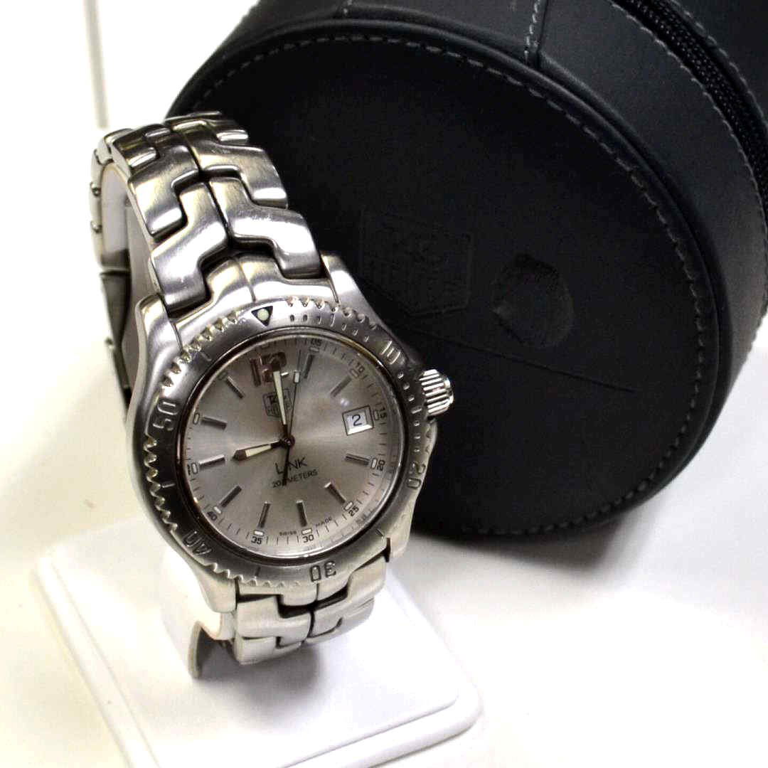 Man's Stainless Tag Heuer Link Watch: Man's stainless Tag Heuer Link watch #WT1112-2 with silver dial and date, sapphire crystal, water resistant to 200m, Swiss movement and good condition.