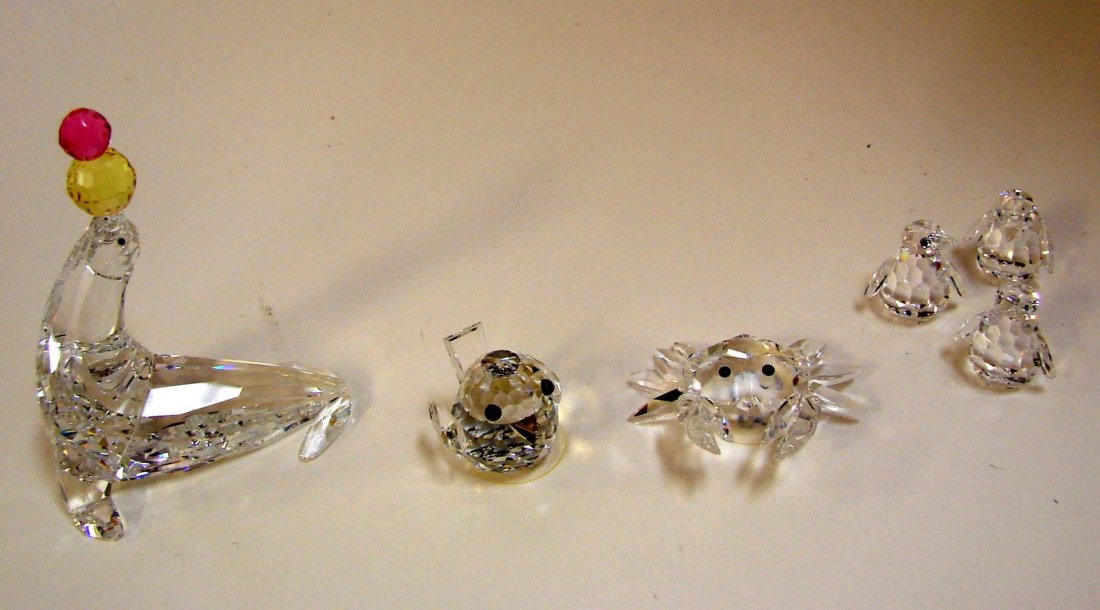 Swarovski Playing Seal, Sparrow, Penguins, Crab: Swarovski Playing Seal ( Cheerful Times), Sparrow, Penguins & Crab (Aquatic World); original boxes.