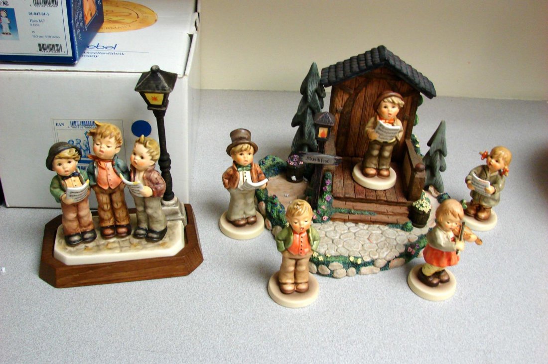 Hummelscape: Music Makers and 6 Hummels: Hummelscape: Little Music Makers, Steadfast Tenor, First Solo, First Violin, Lamplight, Hitting the High Note; A Tuneful Trio (lampost has been repaired.) All original boxes.