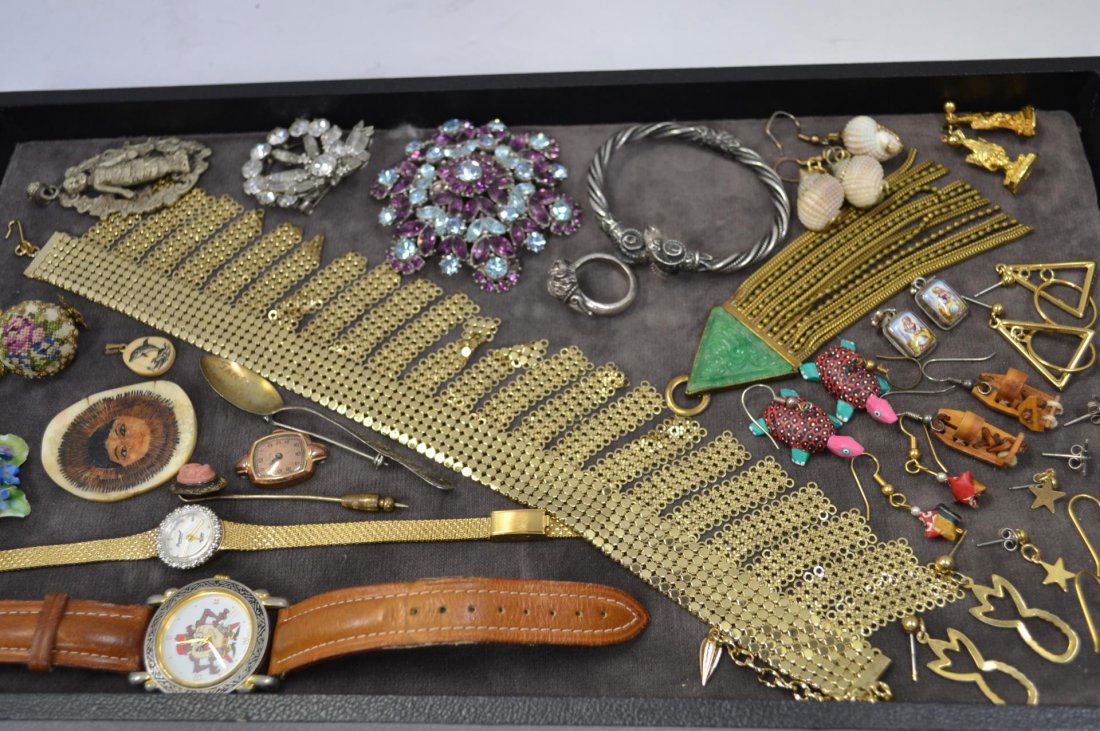 Lot of Assorted Jewlery: Lot of assorted vintage jewelry; scrimshaw, Staffordshire pin, Whiting & Davis necklace, Trifari brooch (some stones missing), ram jewelry in sterling, jade pendant and many earrings.