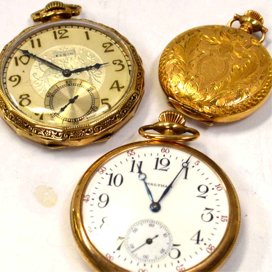 3 Pocket Watches: 3 pocket watches, Waltham, open face with white dial (not running), Elgin open faced, beige dial with filigree bezel and 15 Jewel(good running), and Dueber with filigree case(not running).