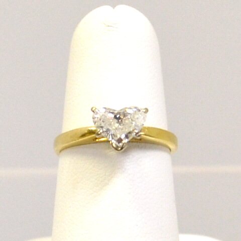 1ct Heart Shaped Diamond Engagement Ring: 14kyg tiffany style mounting containing one heart shaped diamond weighing approx. 1ct, clarity I1 and J color, finger size 6 1/2. Lazer drilled. 2.9gm