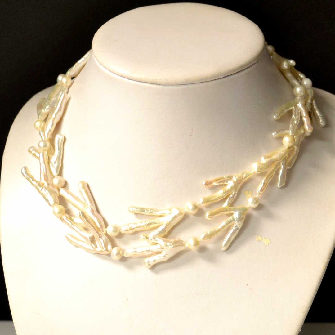 Double Strand Baroque Pearl Necklace: 2 strand baroque pearl necklace with 35mm baroque pearls alternating with 7mm rounds, 18" inside length with silver floral clasp.