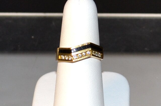 18kyg Black Coral & Diamond Ring Bernard Passman: 18kyg black coral and diamond ring by Bernard Passman with channeled black coral along with 10 channel set diamonds in a zig zag design, .20ctw, finger size 7. 5.7gm