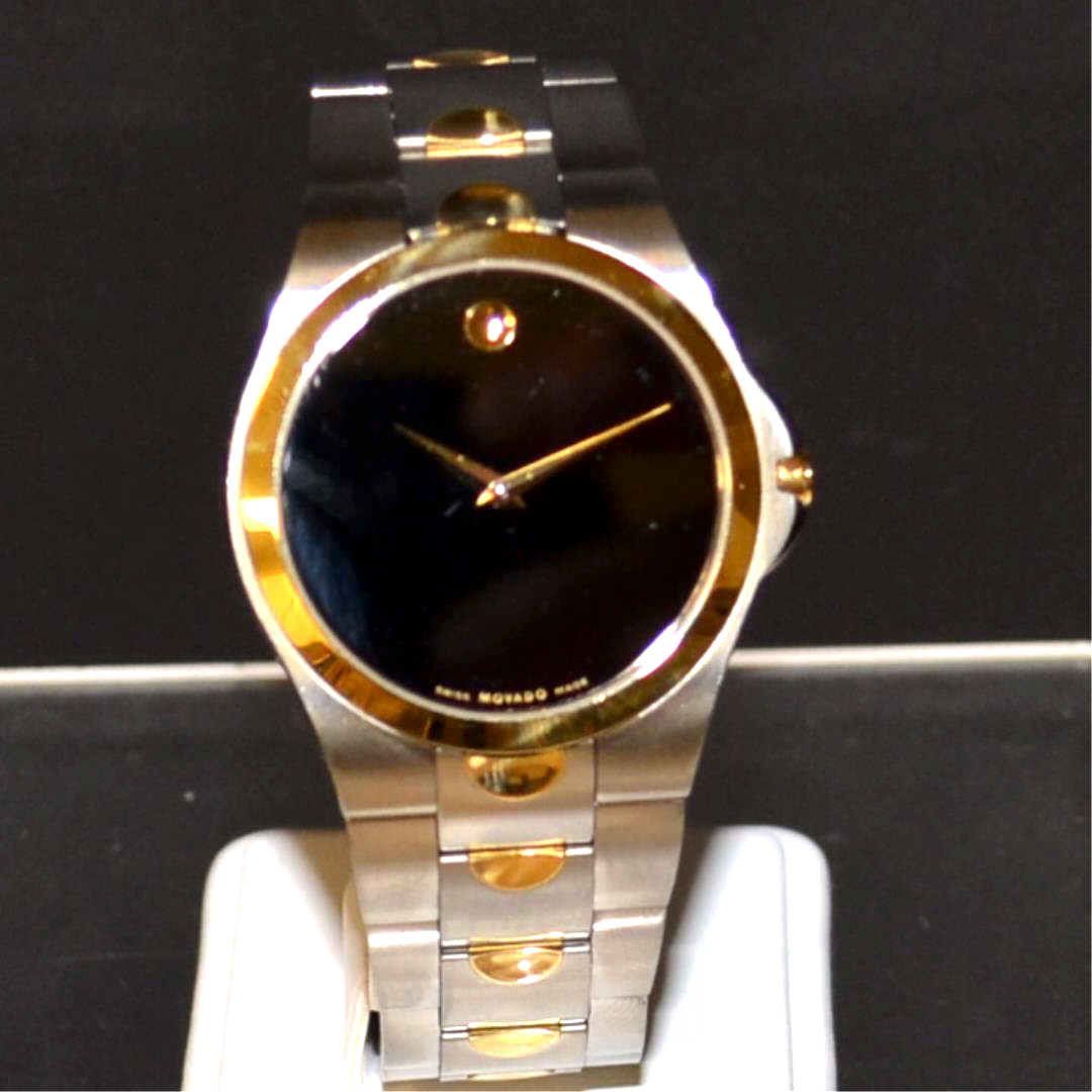 Man's 2tone Movado Museum Watch: Man's 2ton stainless and yellow gold Movado Museum watch, model #81 E7 1850 with black dial, Swiss quartz movement, water resistant and perfect running condition. Never worn.