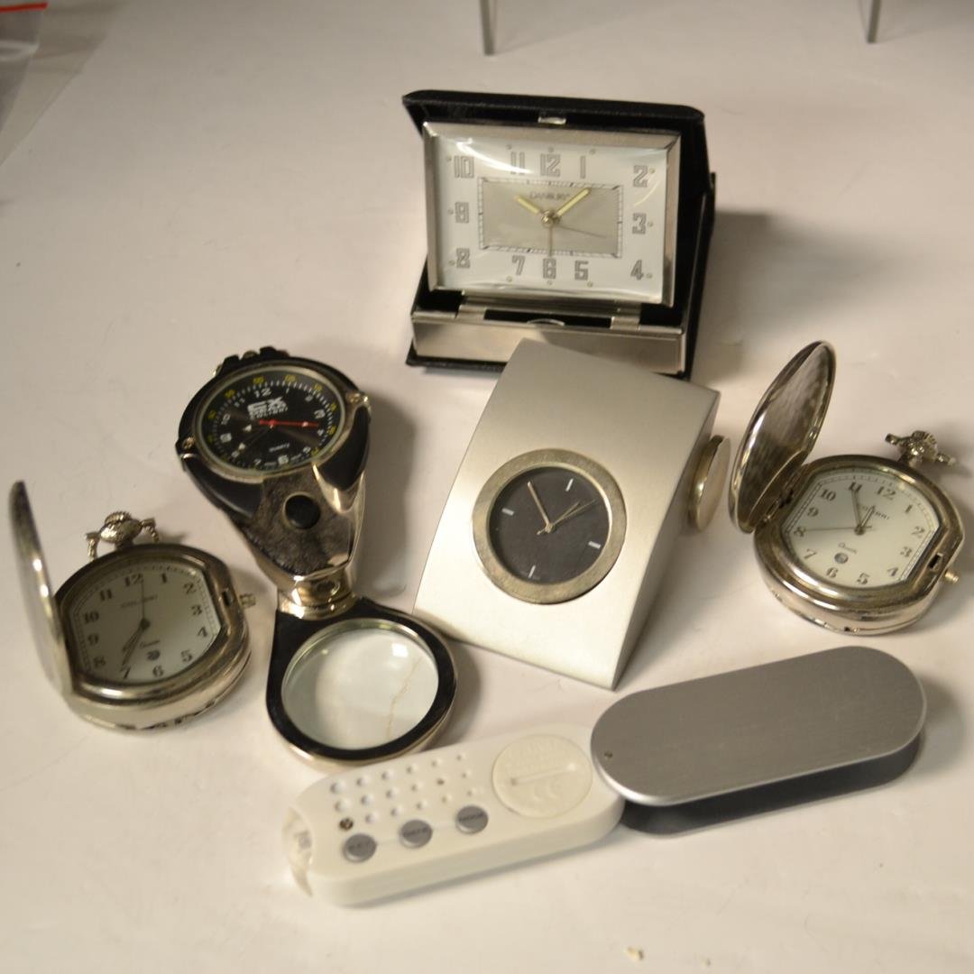 Lot of Assorted Clocks: Lot of assorted clock, Colibri, Danbury etc. One has magnifier and one has a flashlight. All need batteries.