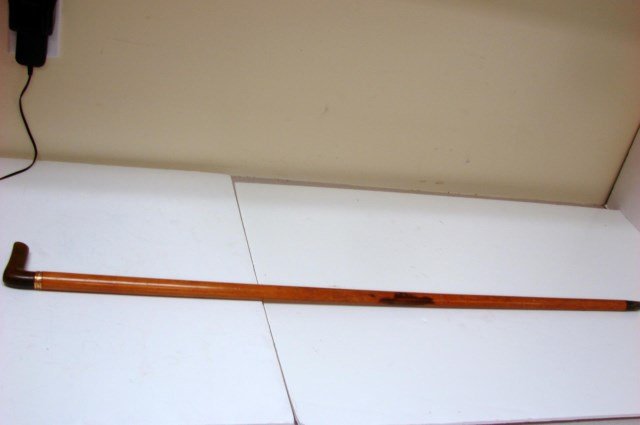 Tiffany burled wood dress cane w/18 kt y/g ferrule: Tiffany burled wood dress cane with an 18kt yellow gold ferrule inscribed EB to AB June 17, 1890, L shaped handle may be rhino horn.