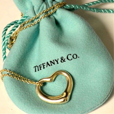 Sterling Floating Heart Tiffany & Co: Sterling floating heart by Elsa Peretti for Tiffany & Co, 7/8" in width with 16" chain.