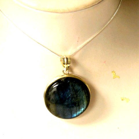 Fire Blue Labradorite Pendant: Blue labradorite pendant measuring 1 1/2" in diameter, bezel set in sterling silver with 20" snake chain.