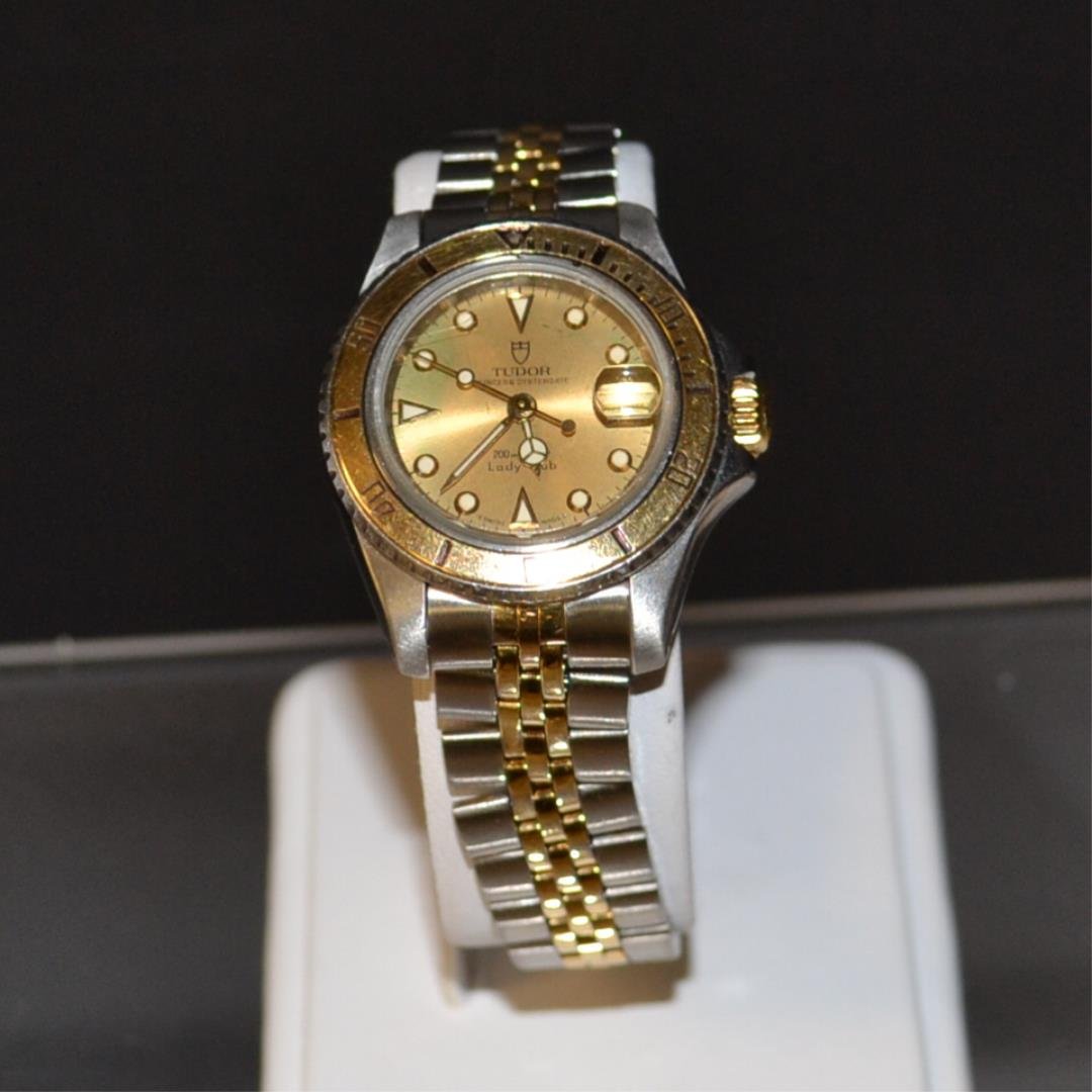 Lady's 2tone Tudor Lady Sub Watch: Lady's 2tone the original oyster Swiss by Tudor with gold dial and bezel, auto mechanical movement, water resistant to 200m, sapphire crystal, Rolex screw down crown and jubilee band.