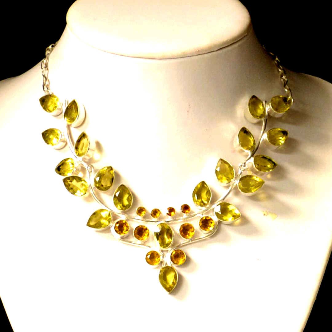 Sterling Lemon Citrine Bib Necklace: Sterling citrine necklace with 20 pear shaped lemon citrine, along with 10 round citrine, bezel set, bib design with 18" adjustable chain.