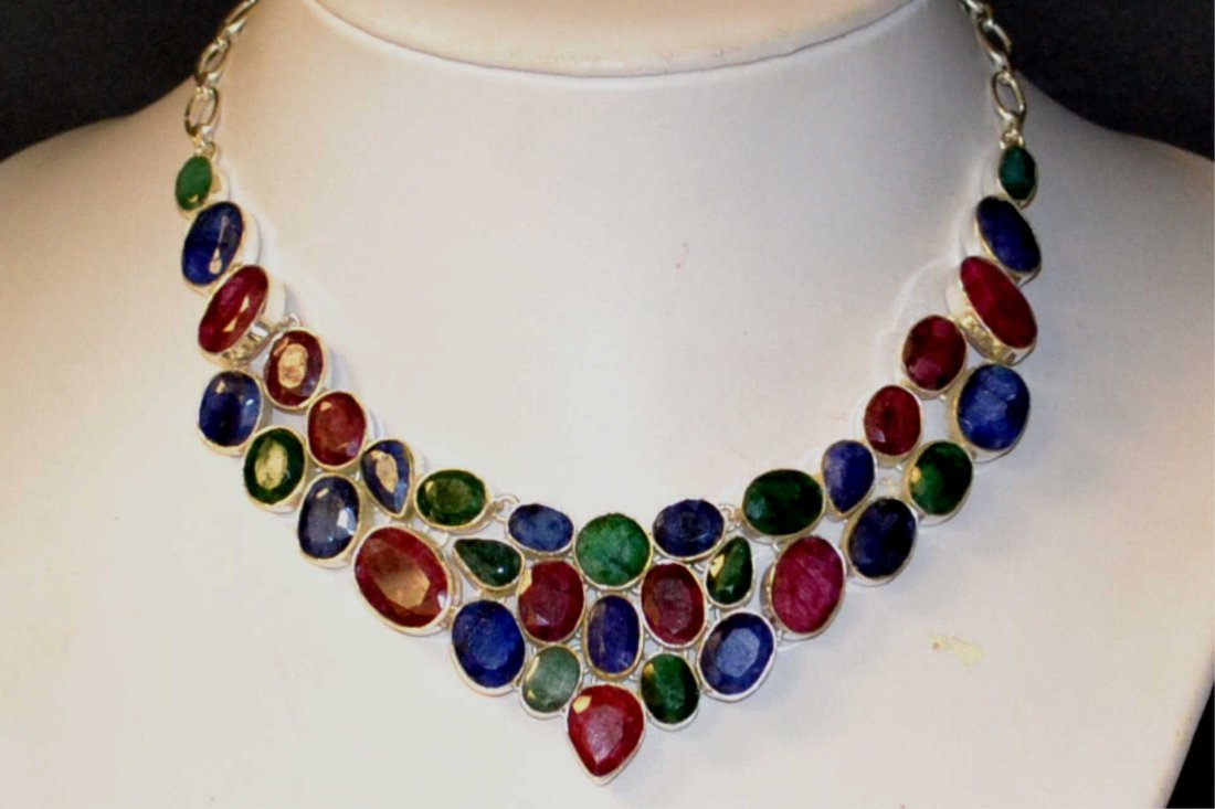 Sterling Colored Stone Necklace: Sterling colored stone necklace with ruby, sapphire, emerald, bezel set, bib design with adjustable toggle clasp and matching earrings.