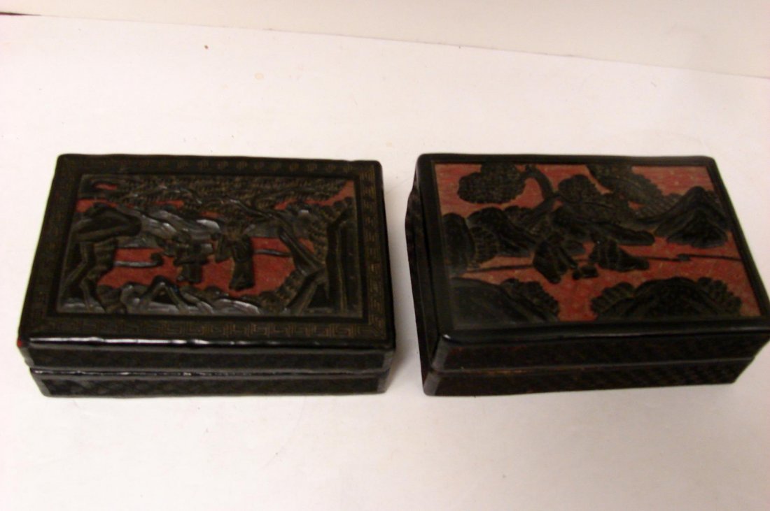 2 Antique Cinnabar Red w/Black Overlay Boxes: 2 Antique Cinnabar Red with Black Overlay Covered Boxes, each approximately 5.5" x 4" x 2"; one with a tiny piece of red showing through on corner.