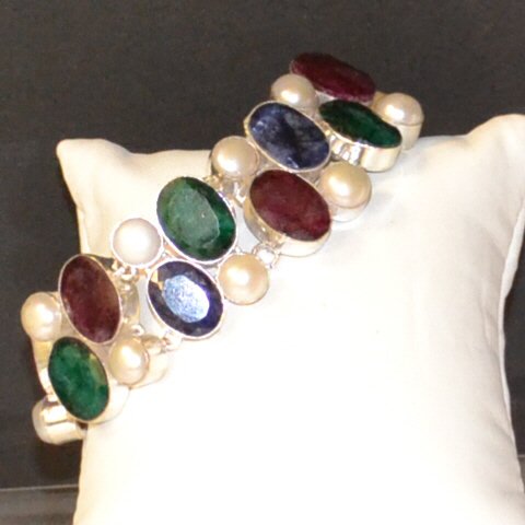 Sterling Sapphire, Emerald & Pearl Bracelet: Sterling colored stone bracelet with emerald, ruby, blue sapphire and pearls, oval shaped and bezeled in sterling , 8mm pearls, 8 1/2" in length, 1" in width with toggle clasp.