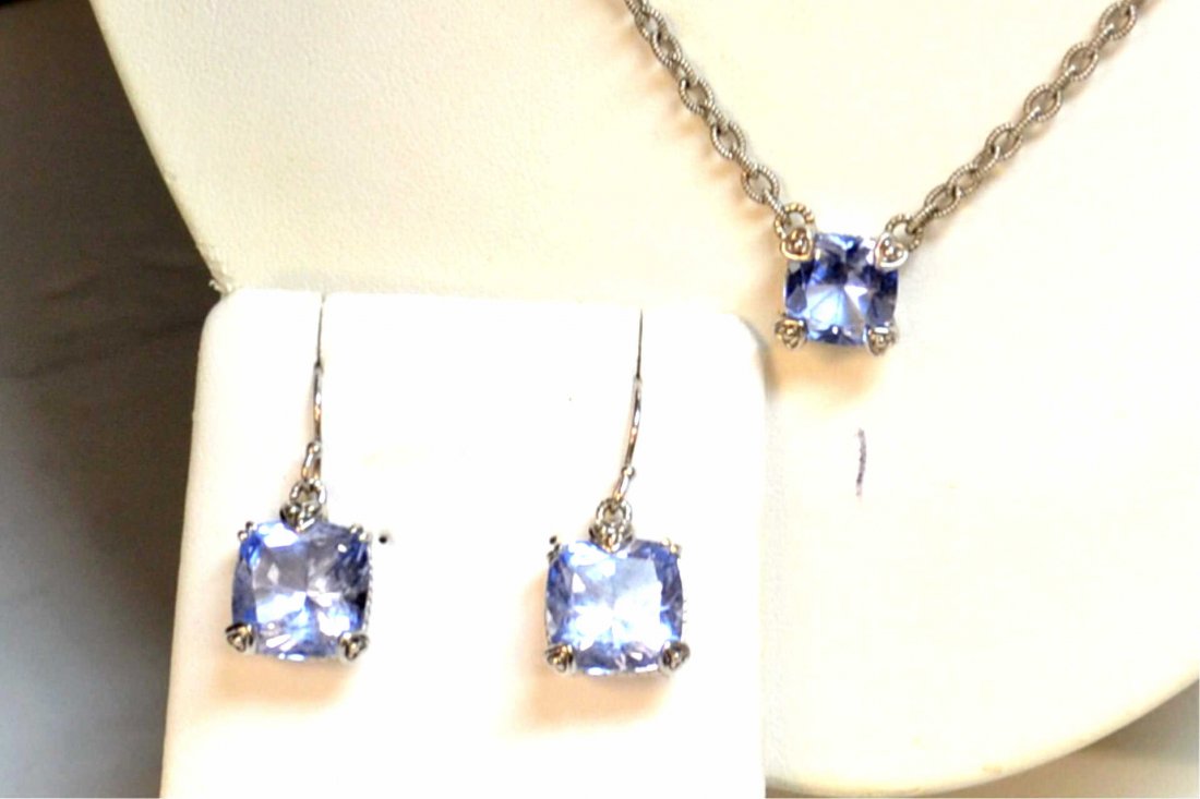 Sterling Blue Crystal necklace By Judith Ripka: Sterling blue crystal necklace with textured chain,along with cushion shaped blue crystal measuring 10x10mm, 17" in length with matching earrings.