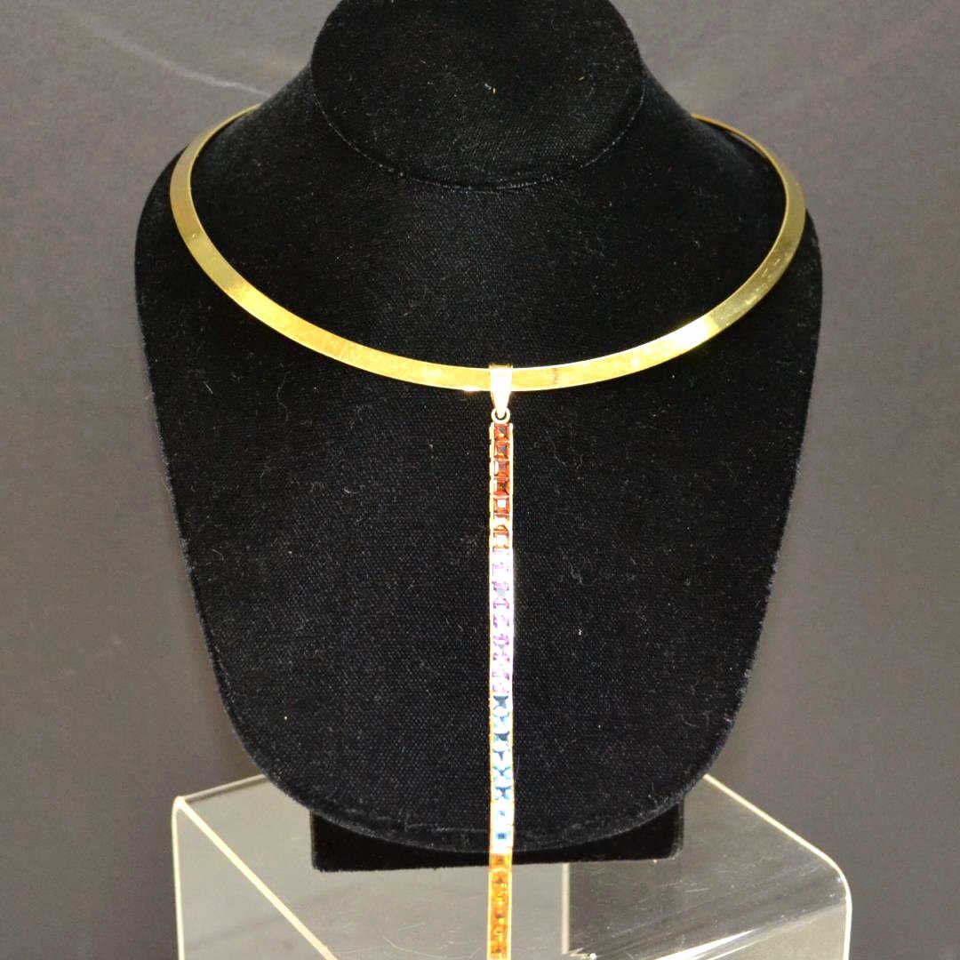 Yellow Gold Choker With 14kyg Colored Stone Drop: 16" Yellow gold plated choker with 14kyg colored stone drop consisting of channel set princess colored stones, garnet, amethyst, blue topaz, citrine and peridot, measuring 3x3mm, 7" in length. 11gm
