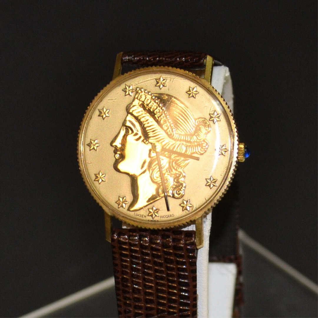 14kyg Lucien Piccard Coin Style Watch: 14kyg Lucien Piccard coin style watch, gold dial with the look of the American liberty coin, 33mm case, mechanical movement, sapphire crown, brown lizard band and good working condition. 27gm