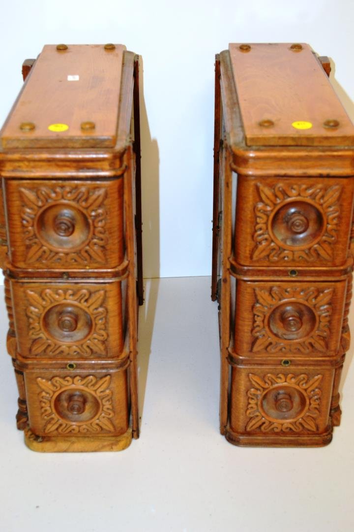 Two Sets of Drawers from a Singer Sewing Machine: Two sets of three drawers in oak with carved pulls and applied floral decoration, 16"h. 6"w. 15"d.
