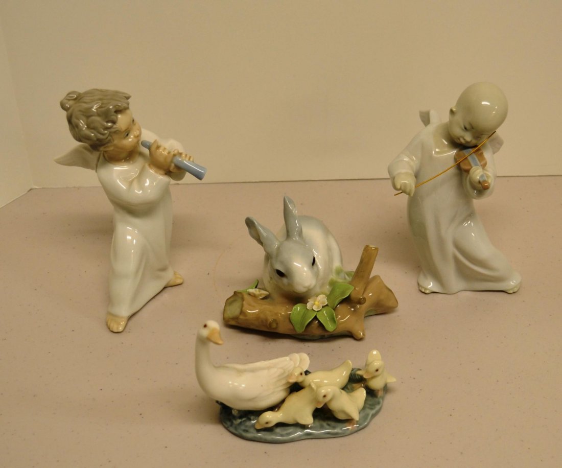 LLADRO figurine #4540, 4536, 4773: LLADRO figurine "Angel with horn", #4540. LLADRO figurine Asian angel playing violin retired 2005 # 4536. Lladro Rabbit retired in 1992 #4773, has small chip on leaf. Lladro family of ducks. No boxes.