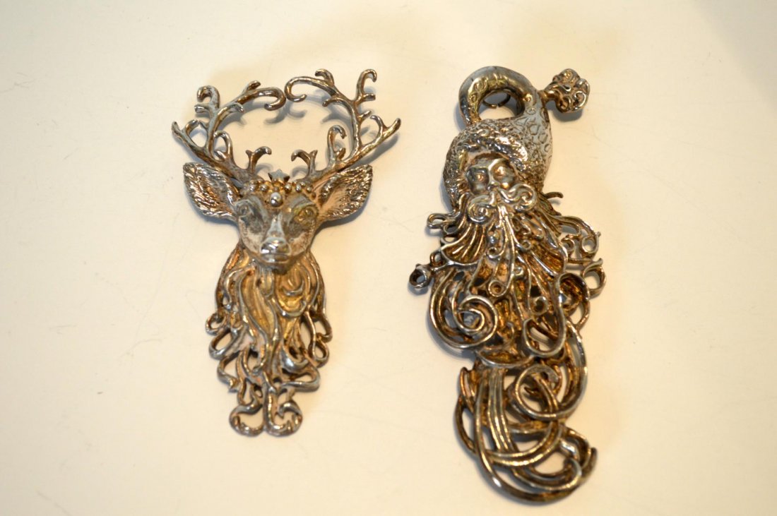 Two Sterling Silver Christmas Ornaments: Two Sterling Silver Christmas Ornaments. Two Radko, figural ornaments, a reindeer, 3 1/2"l. and Santa Claus, 4 1/4"l. 3 oz t.