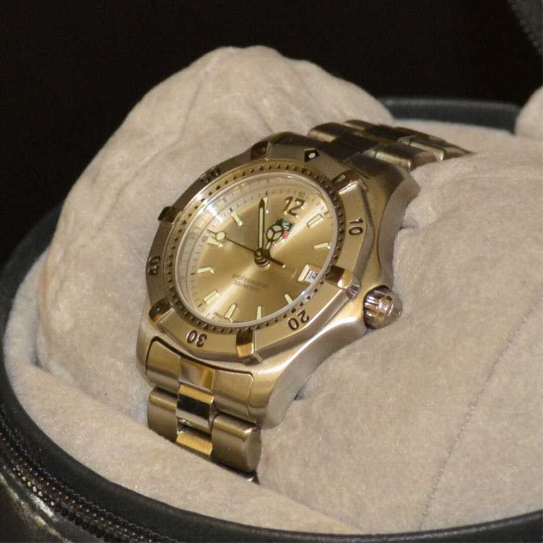 Lady's Stainless Tag Heuer Professional Watch: Lady's stainless Tag Heuer Professional watch with silver dial, date, water resistant, sapphire crystal, Swiss movement, box and papers. Needs Battery.