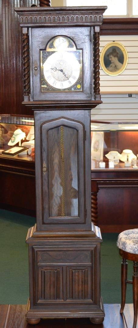 Ethan Allen Grandmother's Clock: Ethan Allen Grandmother's clock with triple chime movement. Includes weights and pendulum. 72 1/2"h.