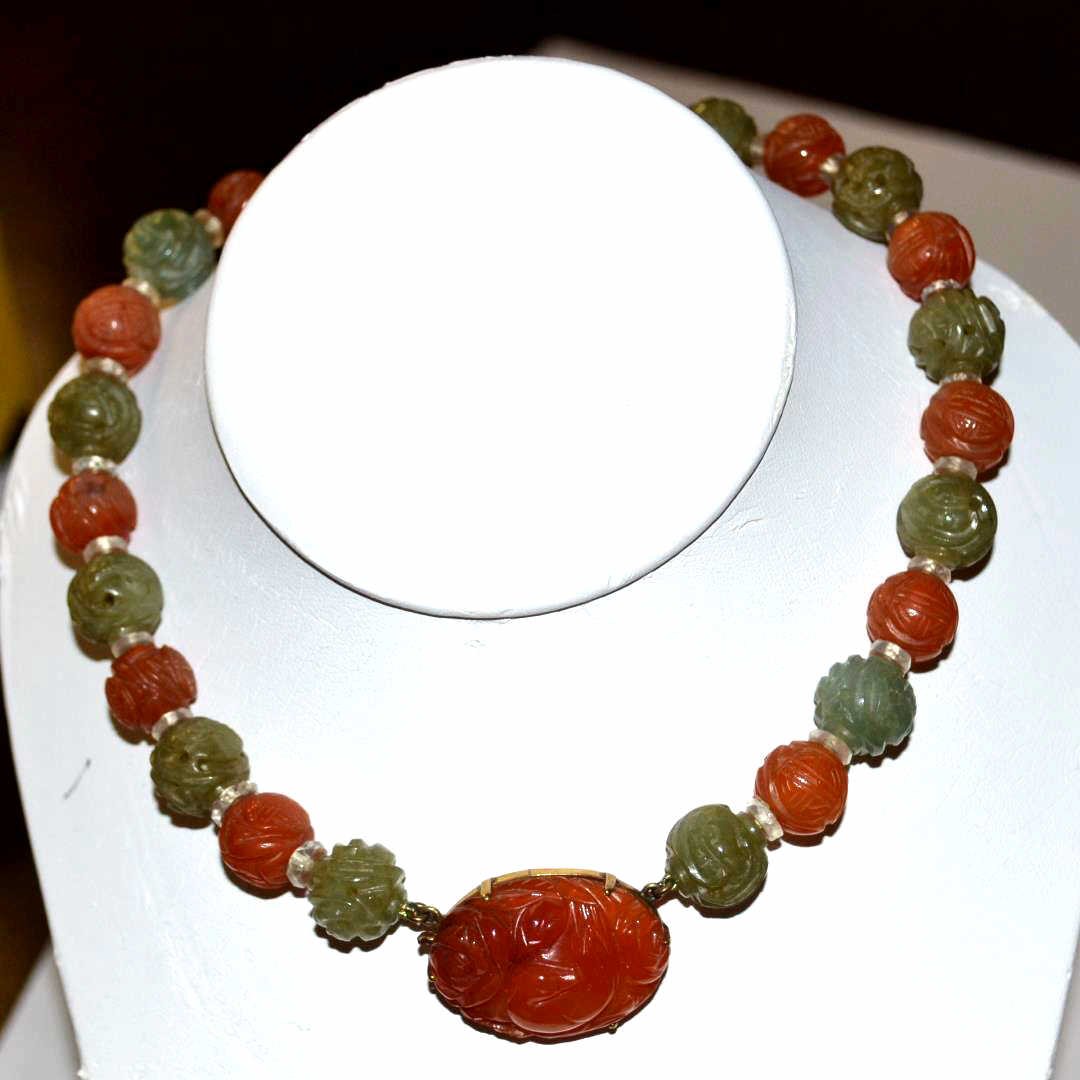 Vintage Carnelian & Jade Necklace: Vintage carnelian and jade necklace with 12mm carved beads separated by clear beads, 15" in length with 14k carnelian clasp.