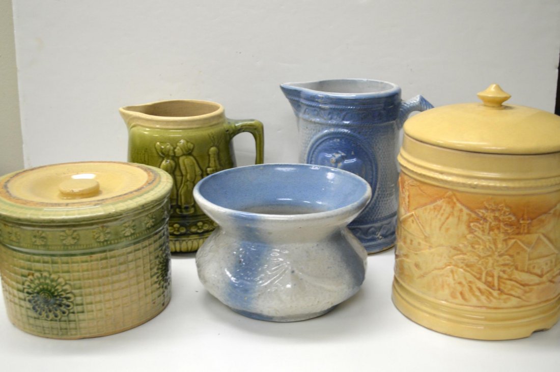 Group Of Early Embossed Clay Pieces: Group Of Early Embossed Clay Pieces. Two blue and white, spittoon, 5"h. and pitcher, 8"h. two green and white, covered storage jar, 5 1/2"h. and pitcher, 7"h. together with a yellow ware covered stora