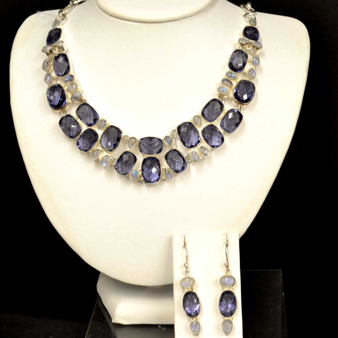 Sterling Iolite & Moonstone Necklace: Sterling Iolite and moonstone necklace with geometric cut rectangular shaped iolite, along with pear shaped moonstone, bezel set, 18-22" in length with matching earrings.