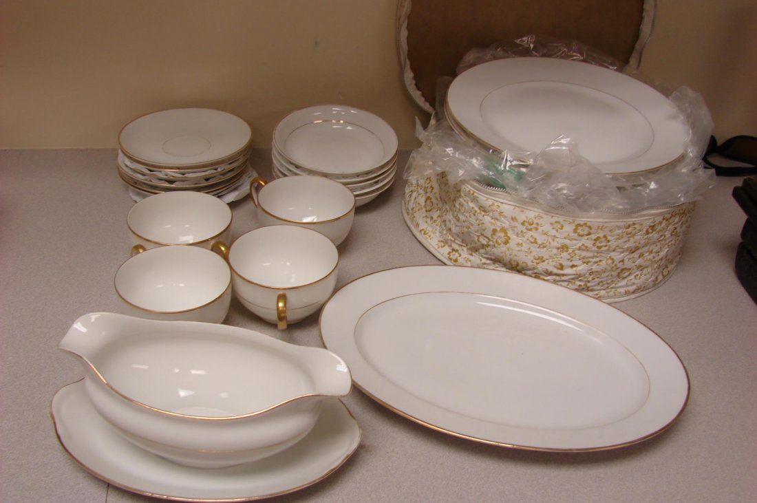 Noritake Nippon Partial Dinnerware White w/gold: Noritake Nippon Vintage dinnerware - 11 dinner plates, 4 cups and saucers, 5 fruit bowls, gravy boat, platter; some loss to gold trim. No chips.