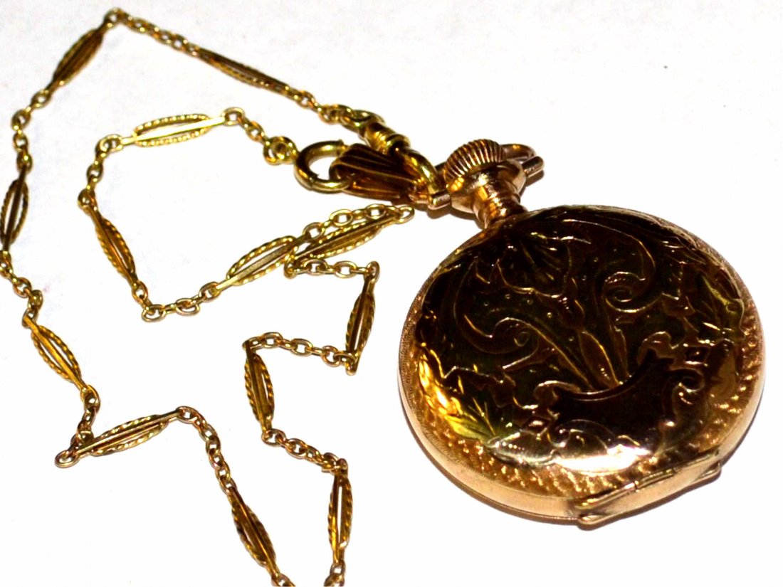 2Tone Elgin Dueber Pocket Watch: Elgin Dueber pocket watch in rose and yellow gold filled with white dial, second hand, 36mm case, along with 12" fob. Good working Condition. 45gm
