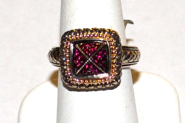 Sterling & 18k Ruby Ring, Gabrielle Bruni: Sterling & 18k ruby ring by Gabrielle Bruni with 24 round prong set rubies, circled in 18kyg beads, along with black enameling and on the shoulders, finger size 7. 10.1gm