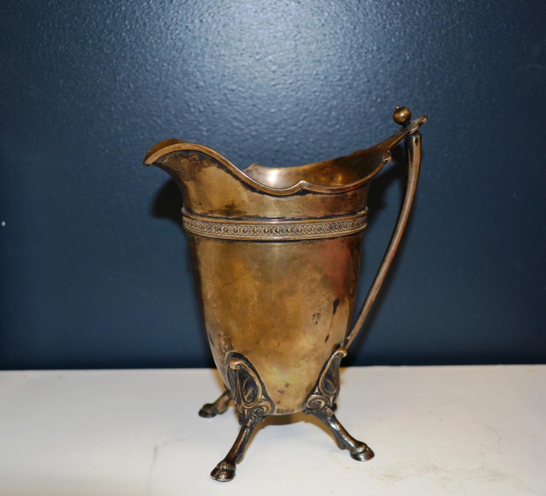 Tiffany creamer 925 sterling: Tiffany creamer 925 sterling, weighs 7.7 ozt and is 6" tall, and four hoofed feet.