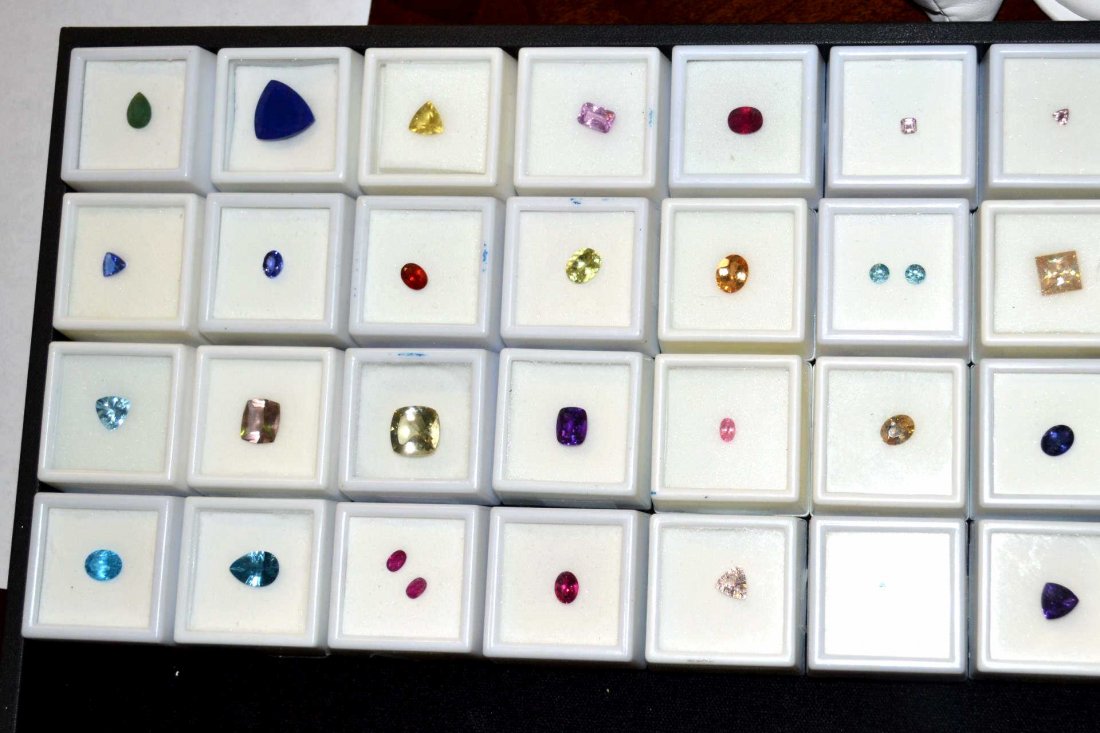 Lot of Loose Colored Stones: Lot of colored stones; tanzanite, rubelite, London blue topaz, amethyst, ruby, aquamarine, apetite, iolite and more.