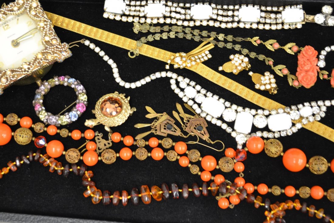Lot of Costume Jewelry: Lot of costume jewelry, rhinestone jewelry, amber, beaded necklace, vintage earrings and Dunhill clock.