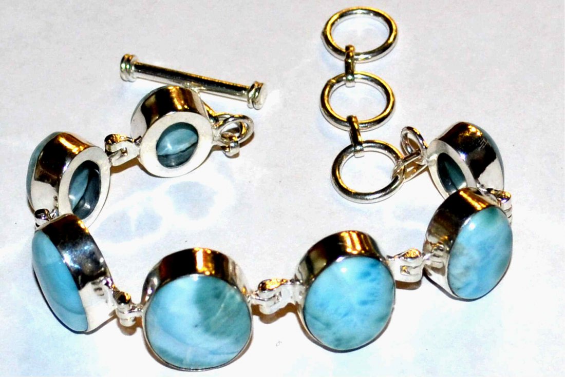 Caribbean Larimar Bracelet: Caribbean larimar bracelet with 7 oval shaped larimar, bezel set and graduated, 9" in length with adjustable toggle clasp. 38.1gm