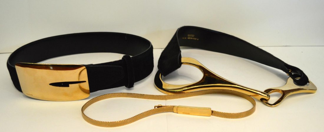Three Gucci Belts: Three Gucci Belts. Brown leather and horse hair belt with gold tone buckle, a thin gold tone belt and a black leather and horse hair belt with gold tone buckle, all size 30.