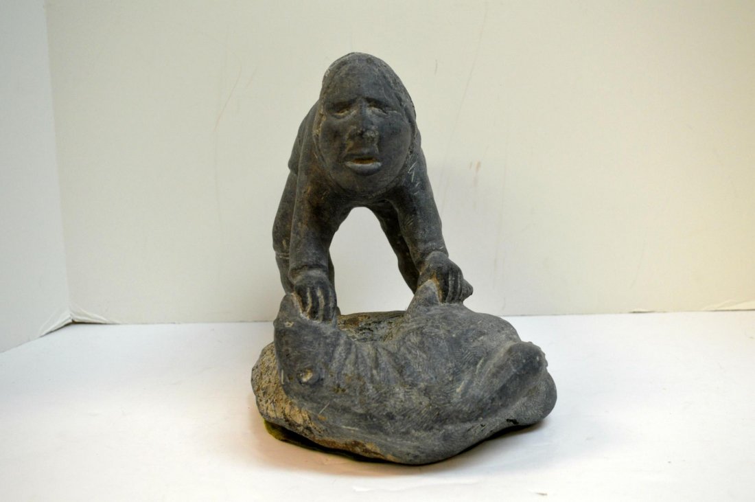 Soapstone Carving: Soapstone Carving. Eskimo Art carving depicting a man and bear, 9 1/2"h.