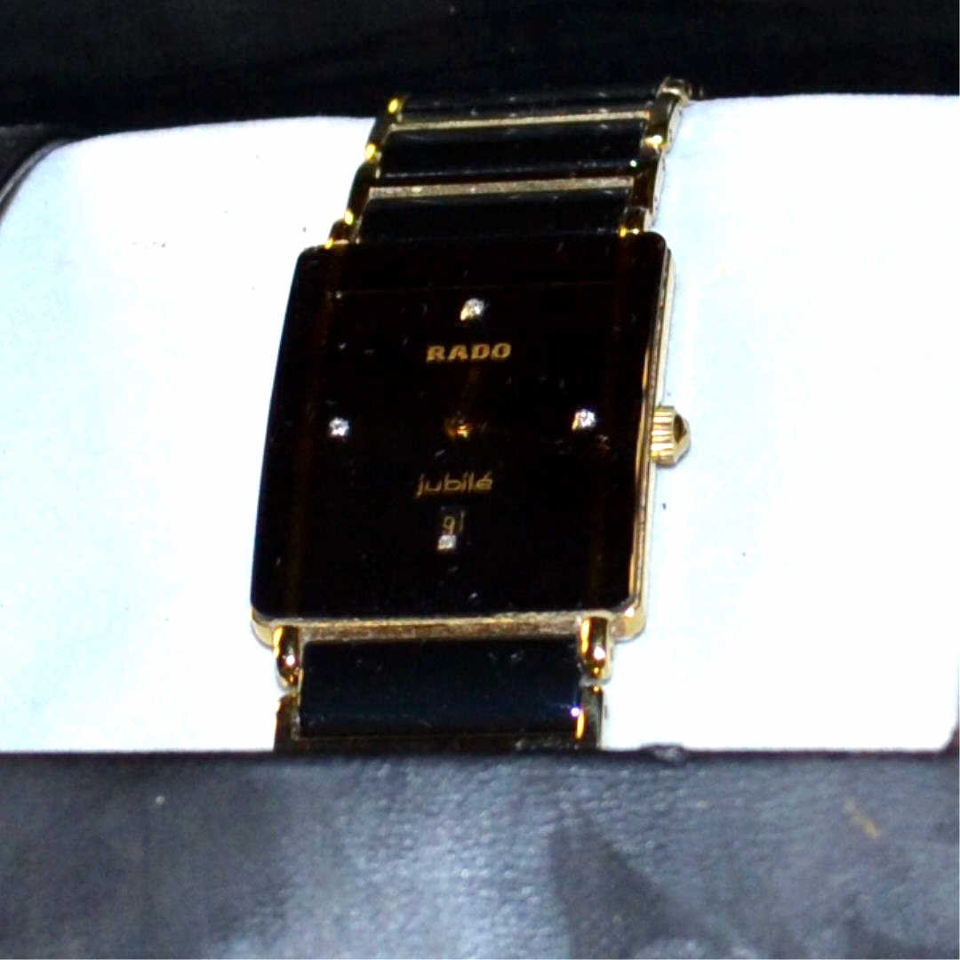 Man's Rado DieStar Jubilee Diamond Watch: Man's Rado DieStar jubilee diamond watch with black ceramic dial with diamonds, date, 18k gold plate, scratch proof crystal, water resistant and ceramic band. Like new with box and papers.