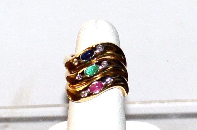 14kyg Stackable Rings: 14kyg stackable rings with bezel set ruby, emerald and blue sapphire, along with 6 round diamonds , wave design, finger size 6. 9.4gm