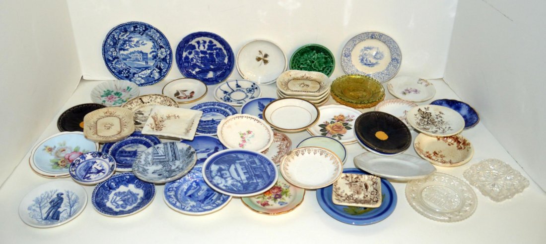 Group Of Butter Pats: Group Of Butter Pats. Approximately forty five, examples include Flow Blue, Tea Leaf, pattern glass, Majolica, Blue Willow, Delft, etc. 2 1/4" to 4 1/2"dia.