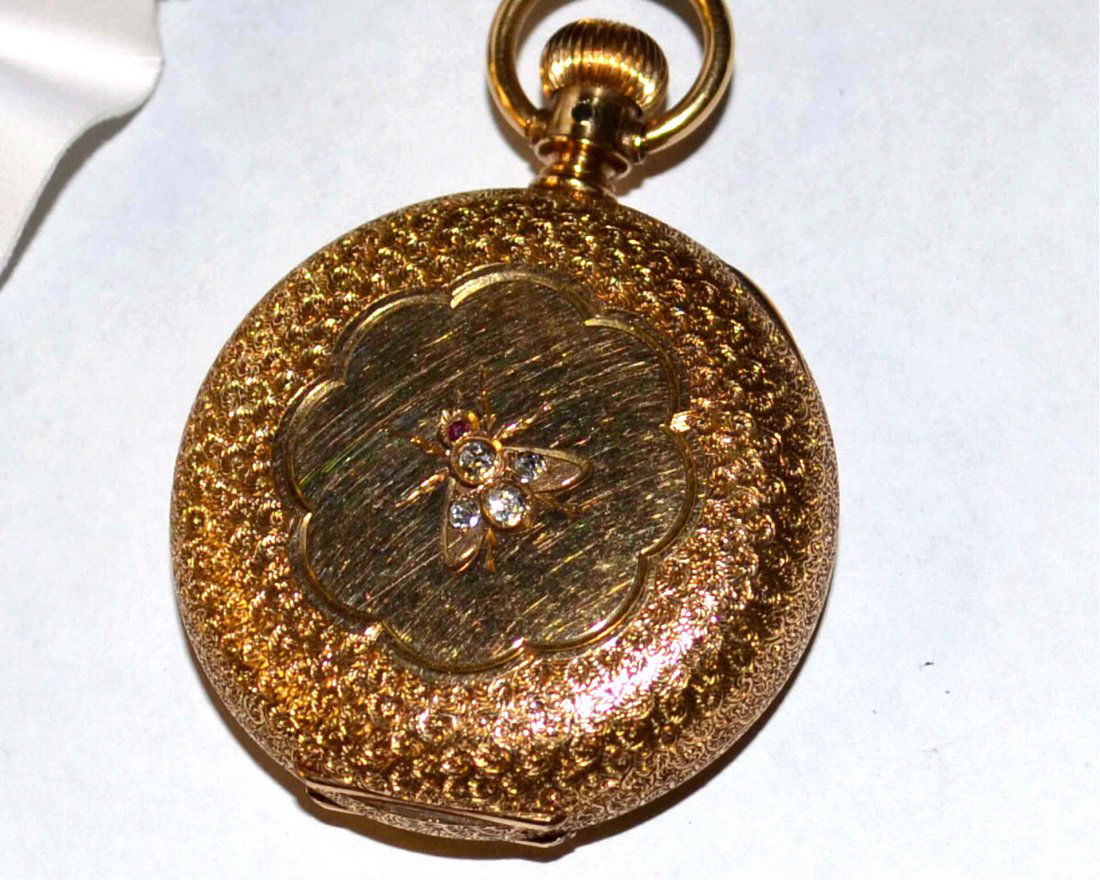 14kyg Waltham Diamond Pocket Watch: Antique 14kyg Waltham pocket watch with white dial, second hand, 41mm case, filigree floral case, with bumble bee containing 4 diamonds and 1 ruby and good running condition. 59gm