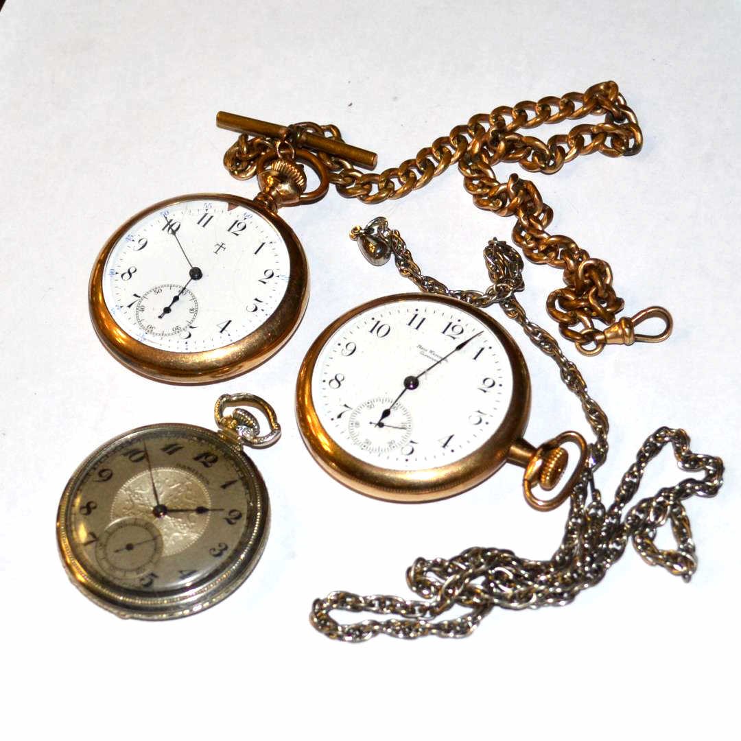 Lot Of 3 Pocket Watches: Lot of 3 pocket watches, Hamilton and Ball Watch Co. Cleveland, 2 white and one silver dial and 2 watch fobs. White gold filled Hamilton in working condition.