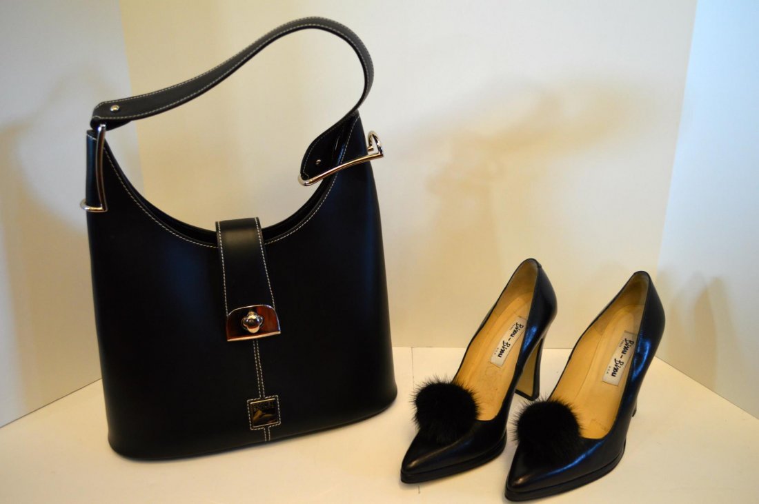Bisou-Bisou Pumps And Dooney Bourke Handbag: Bisou-Bisou Pumps And Dooney Bourke Handbag. Black leather handbag with silvertone hardware, 13"h., together with a pair of black leather pumps with black mink accents, size 8 1/2, 4 1/2" heel.