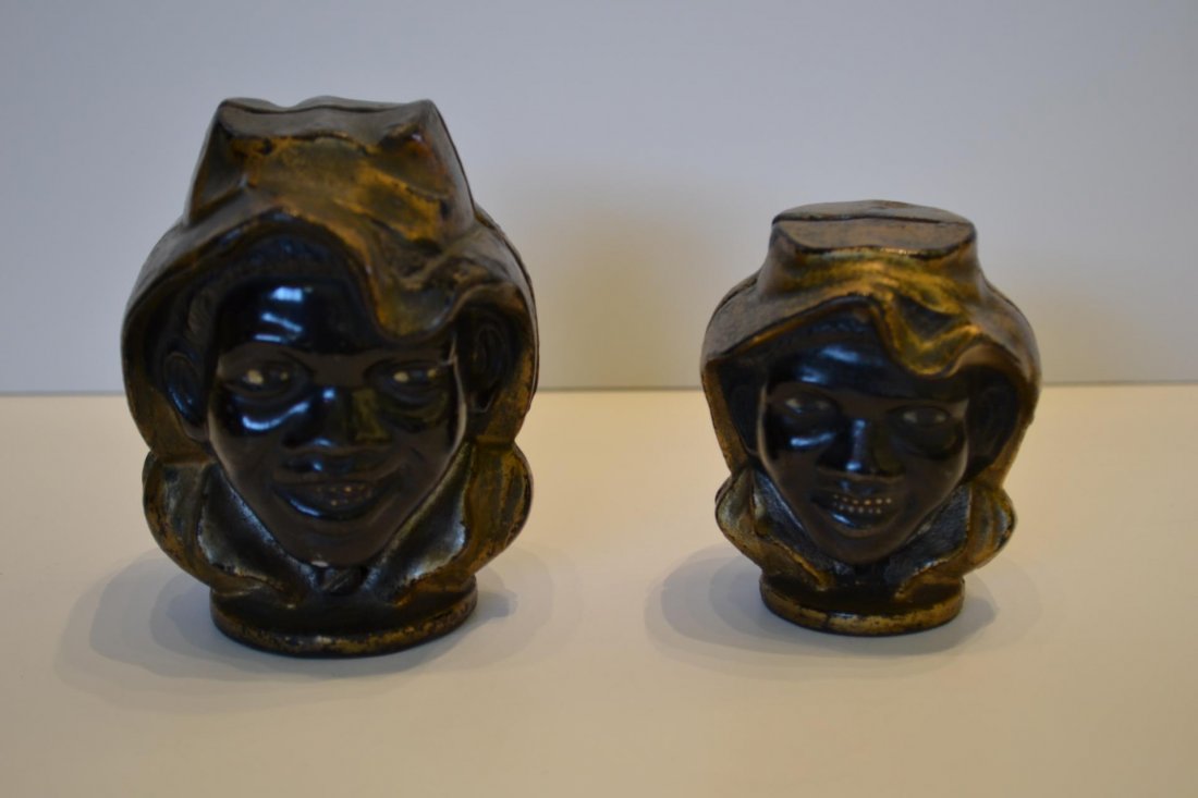 Pair of Cast Iron Still Banks, Two Faced Black Boy: Pair of Two Faced Black Boy bank with gold painted hats, attributed to A.C. Williams, 3" and 4"h.
