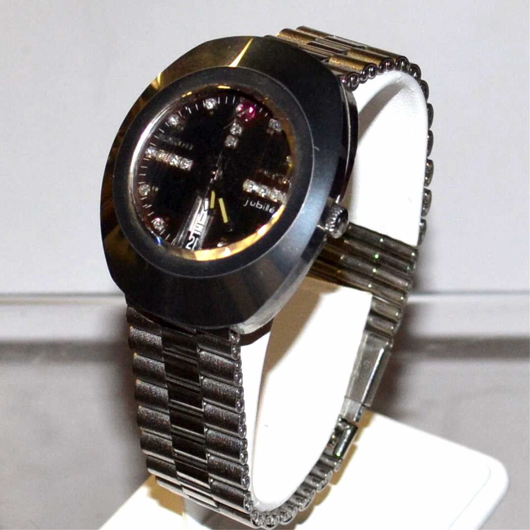 Man's Stainless Rado DiaStar Jubilee Watch: Man's stainless Rado DiaStar Jubilee with black dial, 16 round diamonds on the face, day date feature, automatic movement, water sealed and stainless band.
