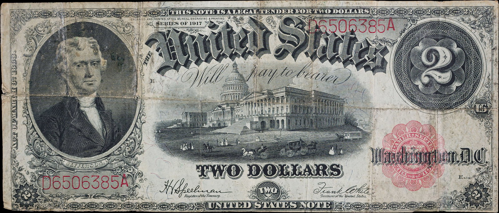 Fine 1917 $2 Legal Tender: Still quite crisp but shows numerous folds and some glue residue at the bottom right.