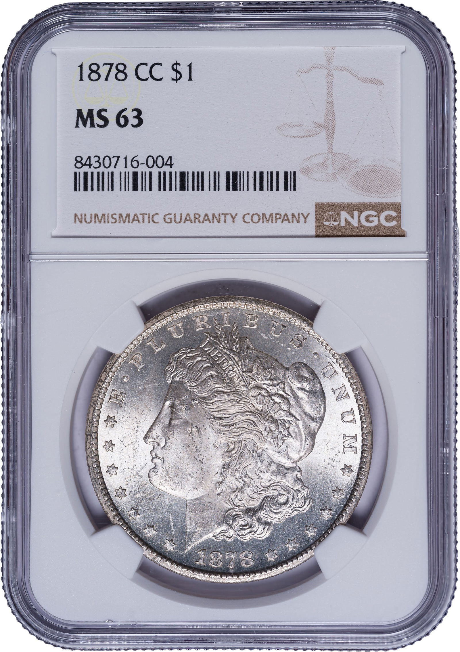NGC MS-63 1878-CC Morgan Dollar: Frosty and lustrous with a dusting of pale golden iridescence. Sharp and appealing for the grade.
