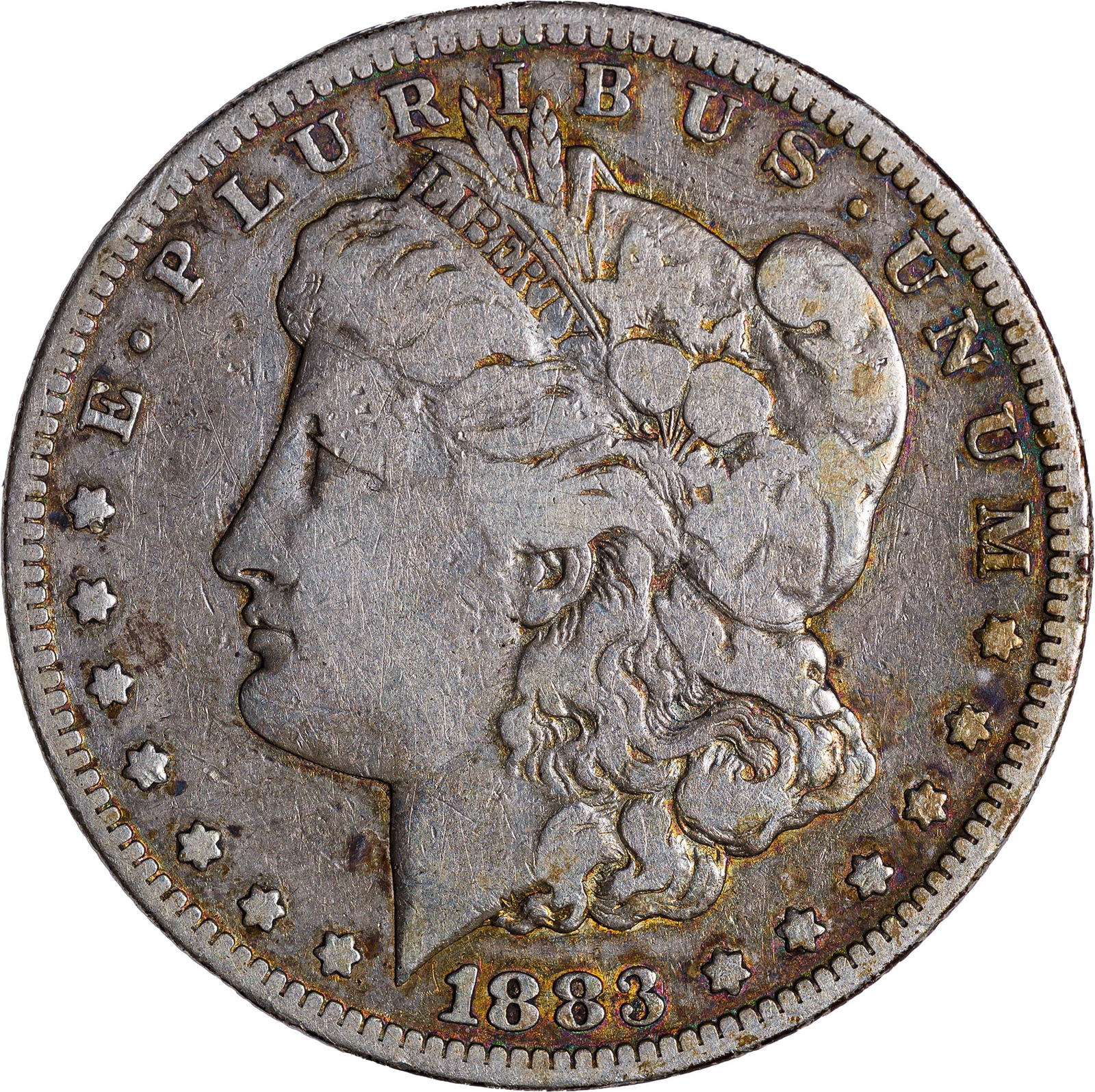 F-12 1883-CC Morgan Dollar: Shows a couple of fine obverse old scratches